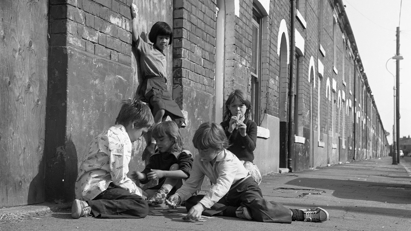 Children playing cards on the pavement in West Hull: Alec Gill