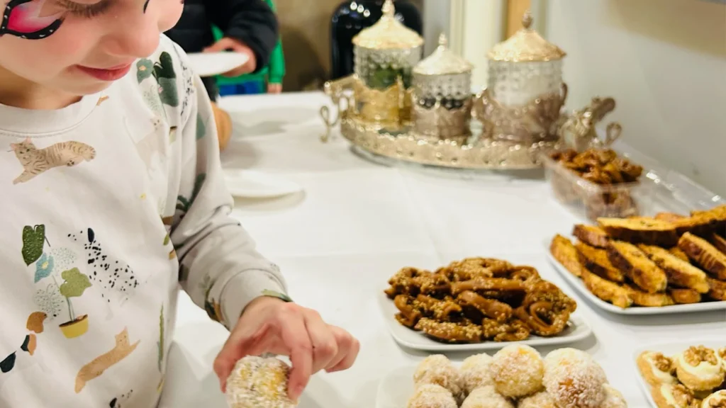 Young girl trying new food at a Giroscope tea party